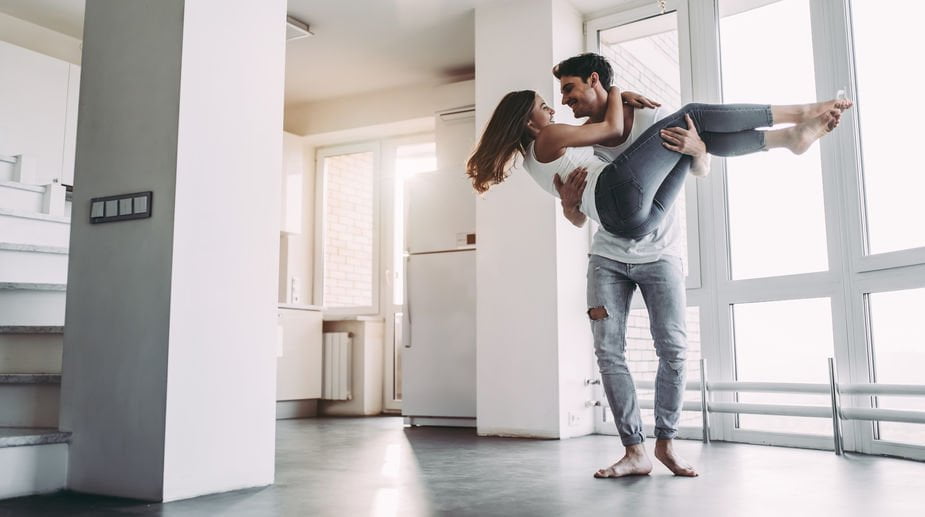 Happy couple in their new apartment